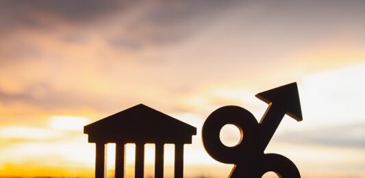 Zinsen, Rezession und Wertpapiere – das sollten Sie jetzt wissen Prozentzeichen und Verwaltungsgebäude