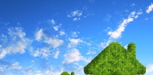 Deka Immobilien setzt auf neueste Technik zur Reduktion von CO₂-Emissionen Grüne Häuser aus Laub, Ilustration