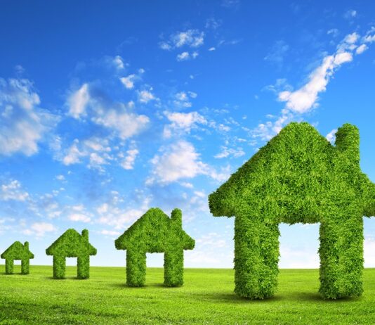 Deka Immobilien setzt auf neueste Technik zur Reduktion von CO₂-Emissionen Grüne Häuser aus Laub, Ilustration