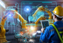 Arbeitsabläufe modern gestalten durch Prozessdigitalisierung Ein Mann steht vor einer Glaswand in der Produktion.